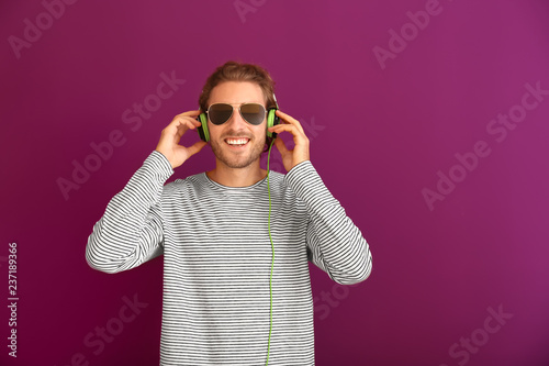 Young man listening to musi...