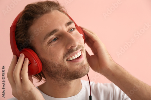 Young man listening to musi...