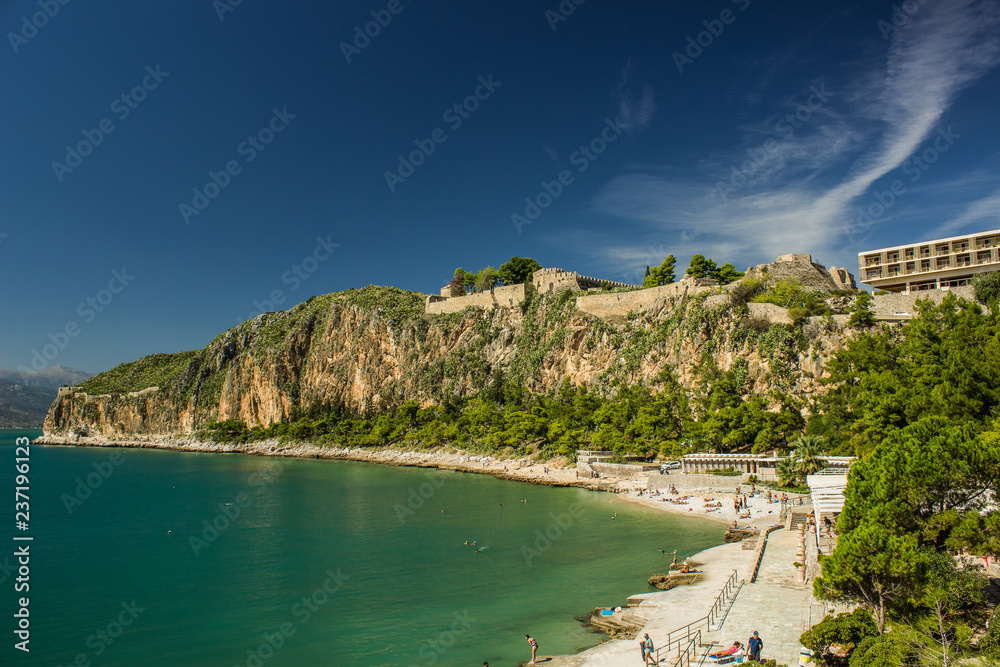 tourist agency summer vacation concept of south Mediterranean landscape view vivid blue and green water sea bay place surrounded by mountain and rocks with economy hotel building apartment and beach 