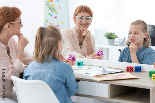 Speech therapist during a treatment with a child