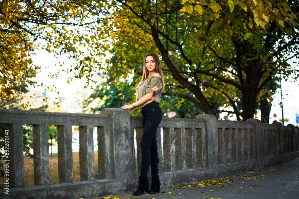 Photographing a girl during autumn with a blurred background Photographing a girl during autumn with a blurred background