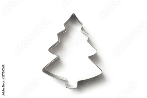 closeup of Christmas fir tree shape cookie cutter on white background