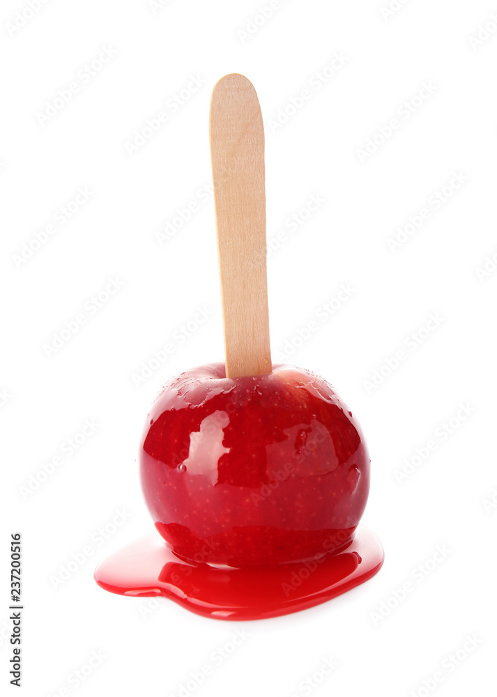 Stick with delicious caramel apple on white background Stick with delicious caramel apple on white background