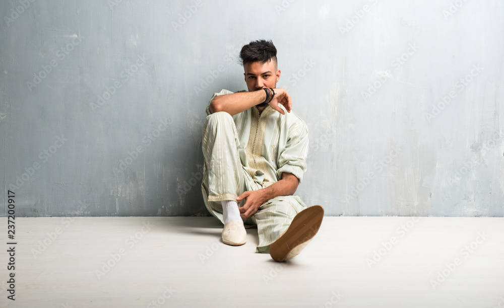 Arabic young man wearing typical arab clothes Arabic young man wearing typical arab clothes