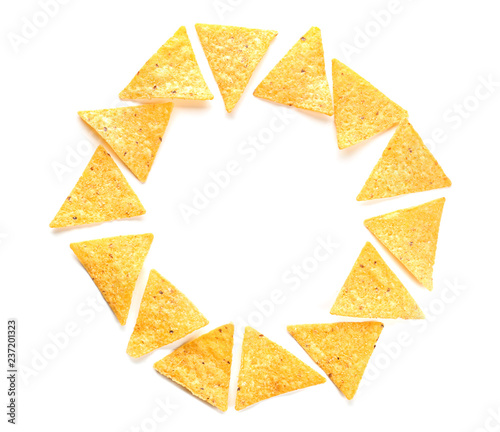 Frame made of corn chips on white background