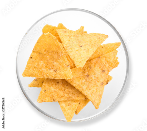 Plate with corn chips on white background