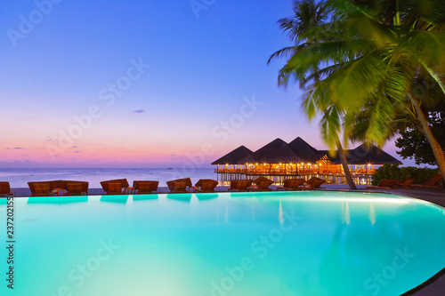 Pool and cafe on tropical Maldives island © Nikolai Sorokin