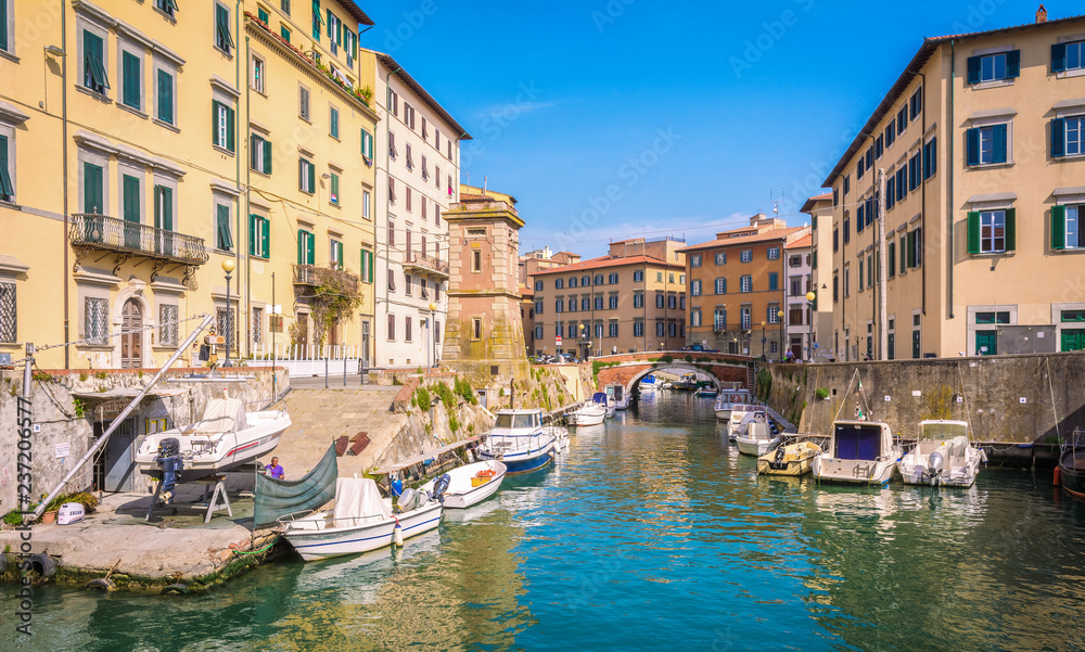 Buildings, canals and boats in the Little Venice district of Livorno, Tuscany, Italy. The Venice quarter is the most charming and picturesque part of the city