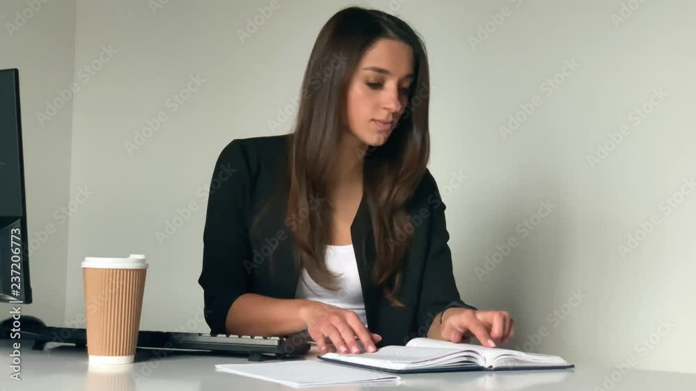 Young successful businesswoman working on computer from her office Young successful businesswoman working on computer from her office
