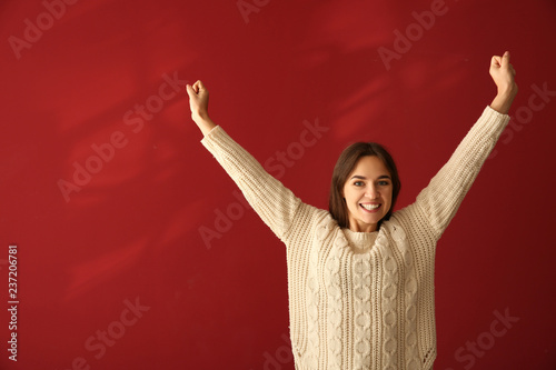 Happy young woman on color ...