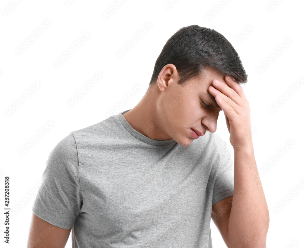 Young man suffering from headache on white background Young man suffering from headache on white background