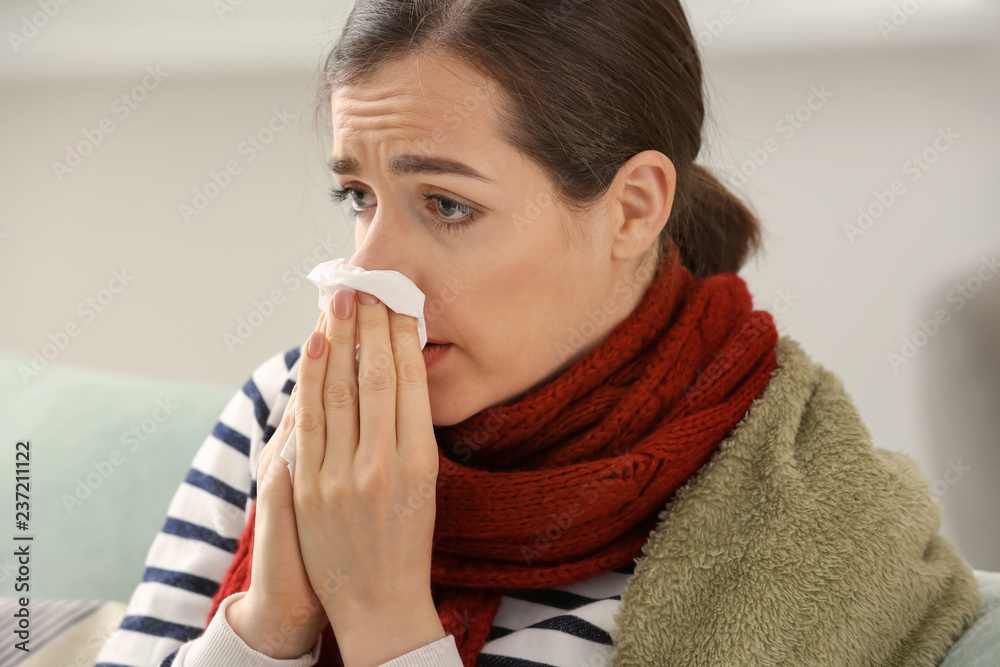 Young woman ill with flu at home Young woman ill with flu at home