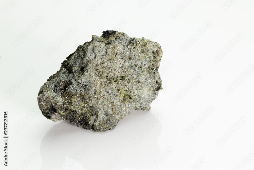 The olivine is a magnesium iron silicate mineral, from Vesuvius volcano,  isolated on a white background, Naples, Italy Stock Photo | Adobe Stock