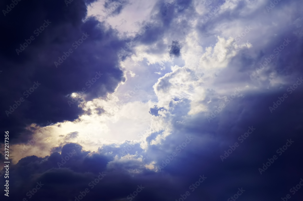 sky with white fluffy and rainy dark clouds after rain. Background texture.  