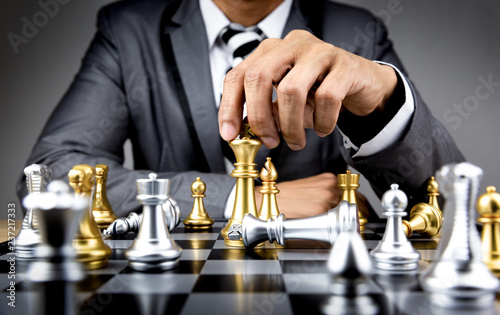 businessman playing chess board
