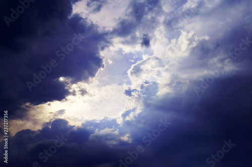 sky with white fluffy and rainy dark clouds after rain. Background texture. 