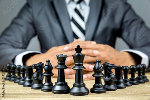 businessman playing chess board