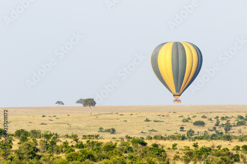 Tourists flying air balloon over the savannah in Masai Mara, Kenya