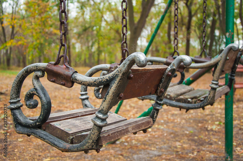 Rustic swings in the playground Rustic swings in the playground