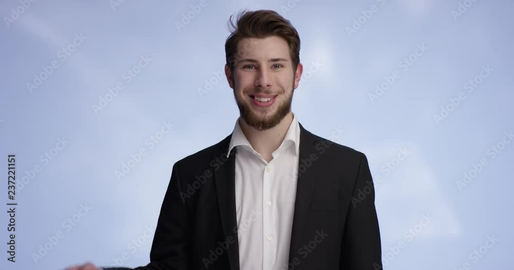 Young attractive man smiling and holding your buisness card Young attractive man smiling and holding your buisness card