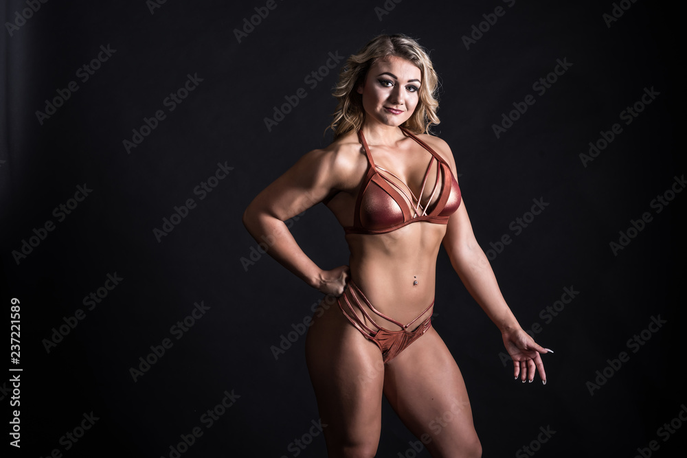 Fototapeta premium Portrait of a muscular young woman. 