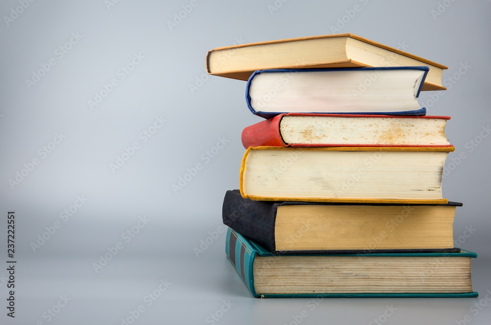 Stack of old books on gray background Stack of old books on gray background