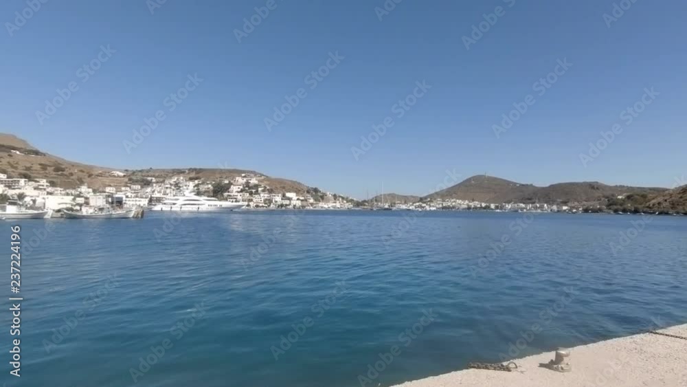 Camera pans fron buoy to the harbour of Skala on the Greek island of Patmos Camera pans fron buoy to the harbour of Skala on the Greek island of Patmos