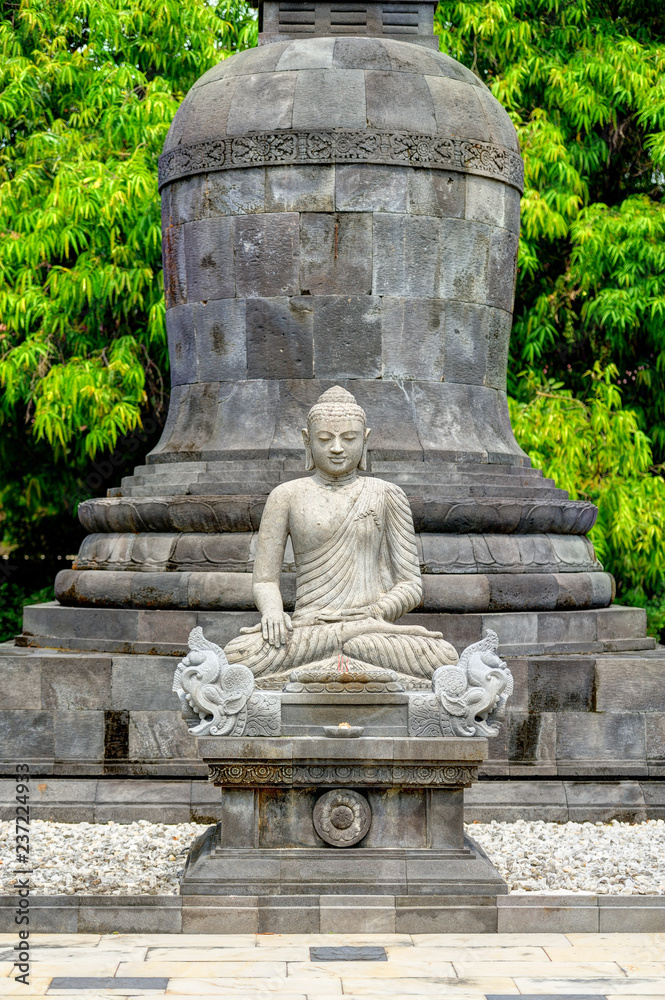 Buddha statue in Candi Mendut Monastery near Borobudur. Central Java, Indonesia