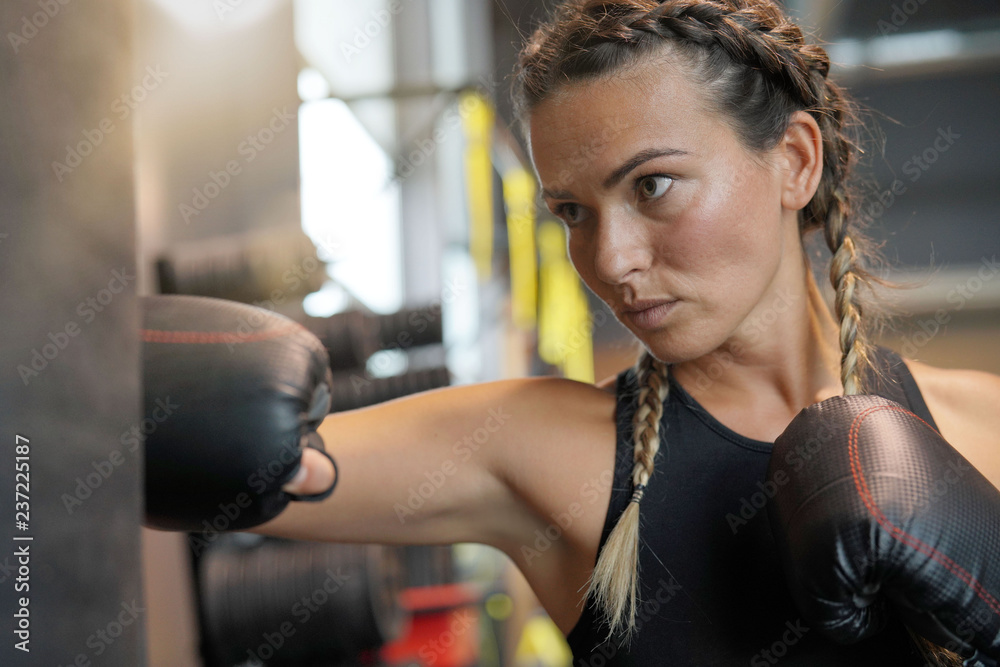  Woman boxing a gym