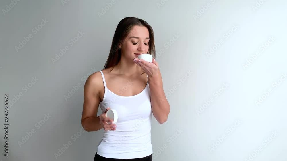 Beautiful Young Woman with Clean Fresh Skin touch her face . Facial treatment . Cosmetology , beauty and spa Beautiful Young Woman with Clean Fresh Skin touch her face . Facial treatment . Cosmetology , beauty and spa