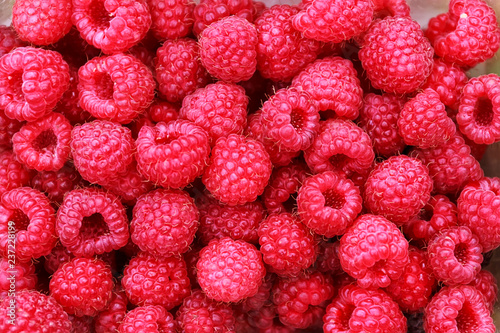 Fresh raspberries background. Summer day, healthy life