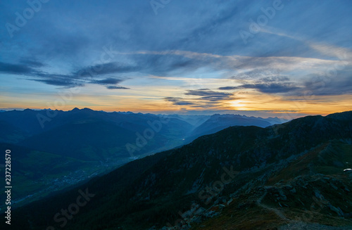 Fototapeta Naklejka Na Ścianę i Meble -  Sunrise from the top of Helm (M. Elmo - 2,434m) down the Pustertal into Austria - Sexten Dolomites, Italy