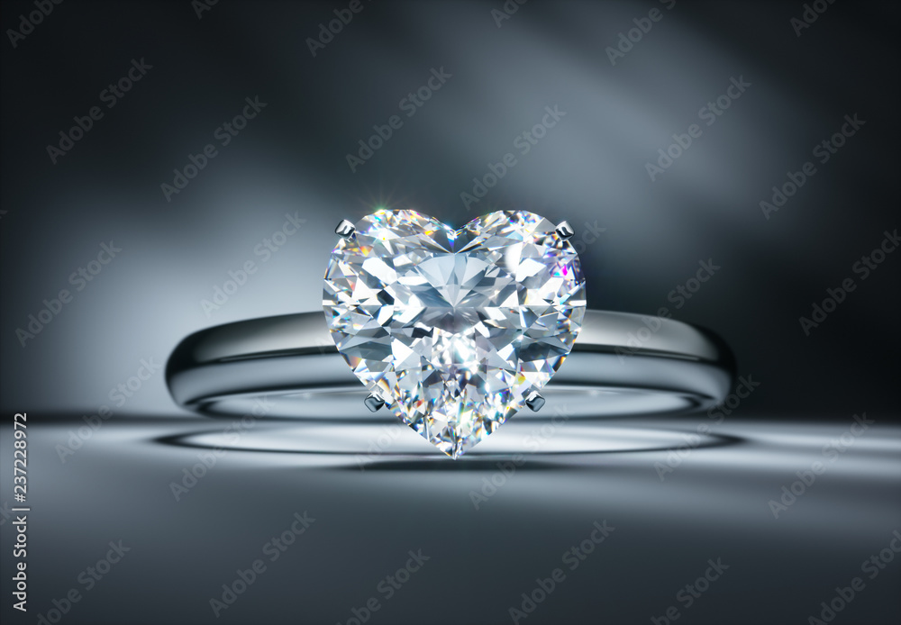 Diamant in Herzform - Solitärring auf dunklem Untergrund Diamant in Herzform - Solitärring auf dunklem Untergrund