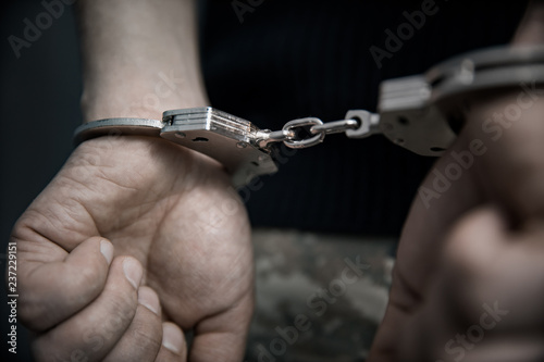 man hand handcuffed