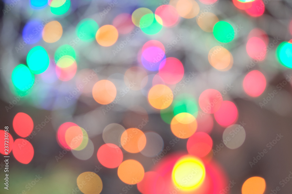Fototapeta premium Defocused abstract multicolored bokeh lights background.Magic explosion star with particles