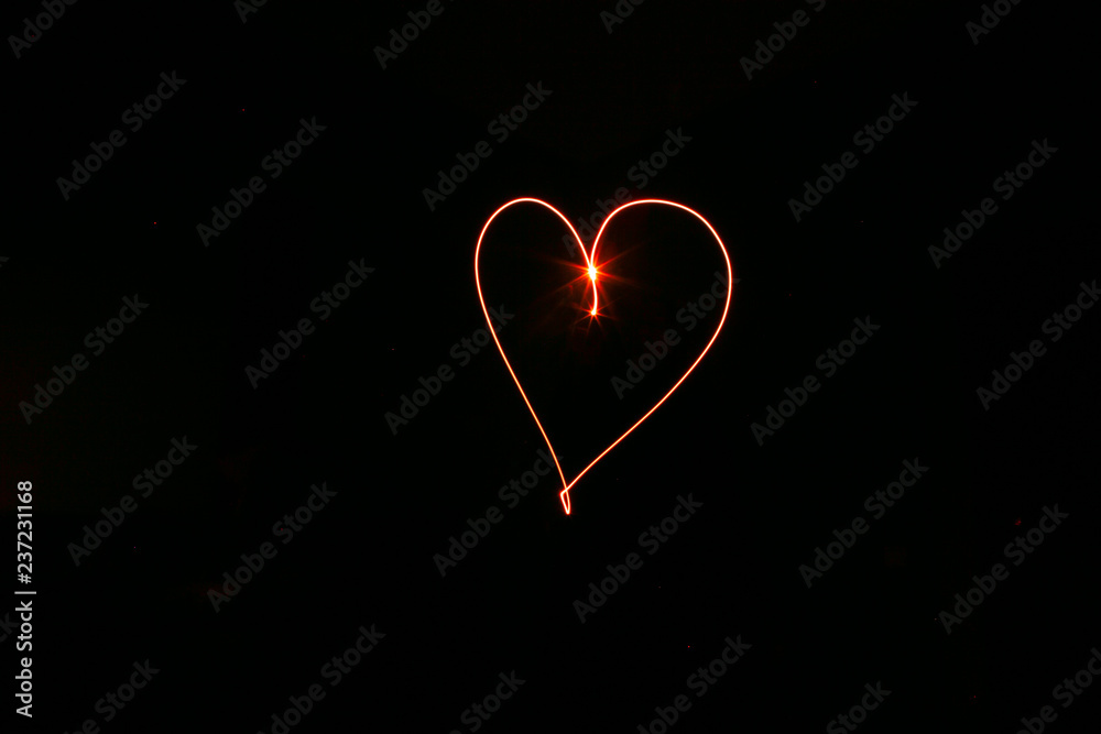 long exposure red heart black background