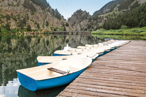 Boat rental for tourists on a mountain lake in the valley of Nuria  Spain. Pyrenees ridge.