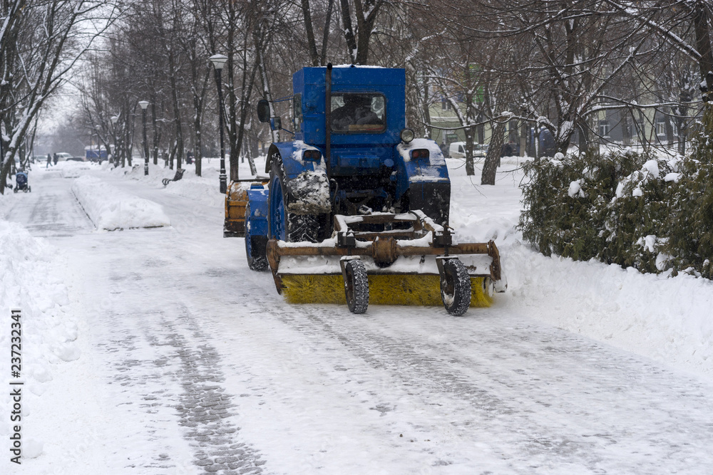 covered with snow, snow removal equipment on the streets to clean covered with snow, snow removal equipment on the streets to clean