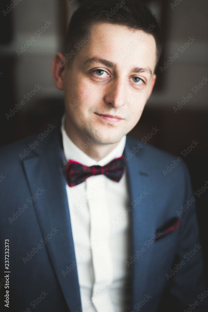 Portrait of happy businessman standing in studio Portrait of happy businessman standing in studio