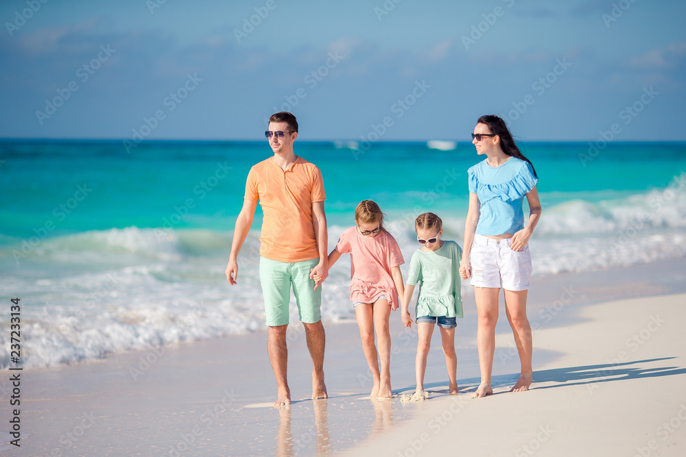 Young family with two kids on beach vacation