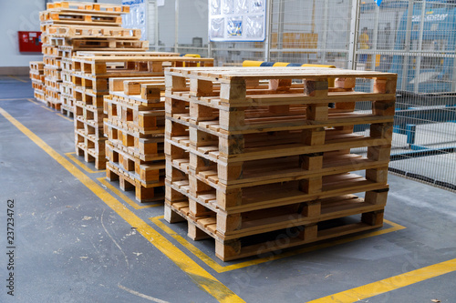 Картината върху платно Stacked wooden pallets at a storage