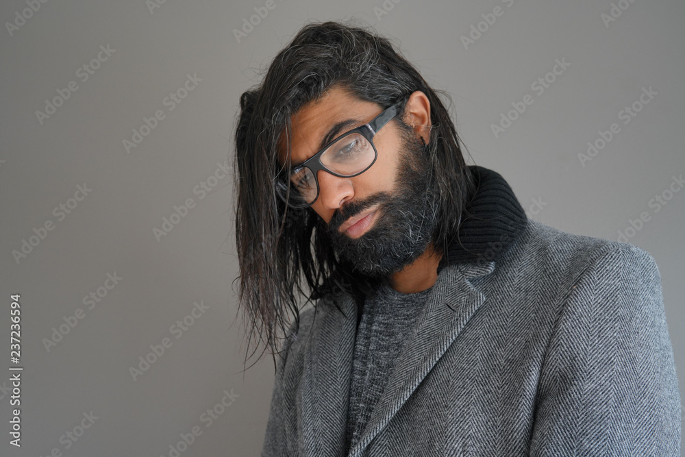Hipster guy with eyeglasses in photo studio Hipster guy with eyeglasses in photo studio