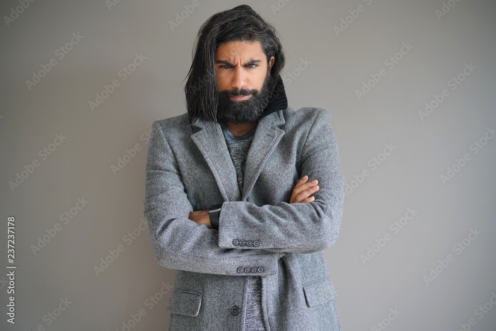 Hipster guy with grey coat, isolated Hipster guy with grey coat, isolated