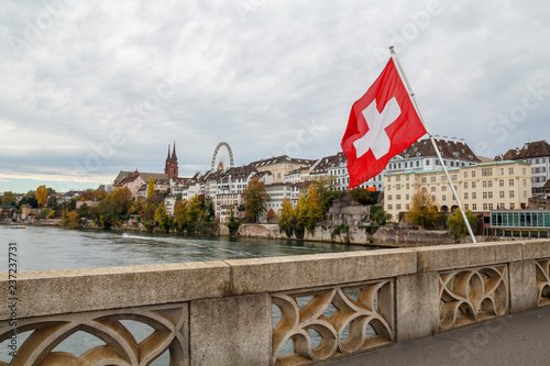 Swiss flag over the river Rhine in Basel, Switzerland
