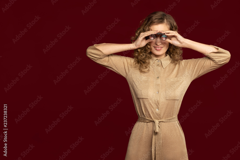 Fototapeta premium girl looking through binoculars like a spy
