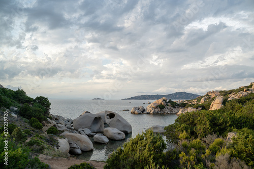 beach with rocks at the italian island sardinia in mediterranean sea photo