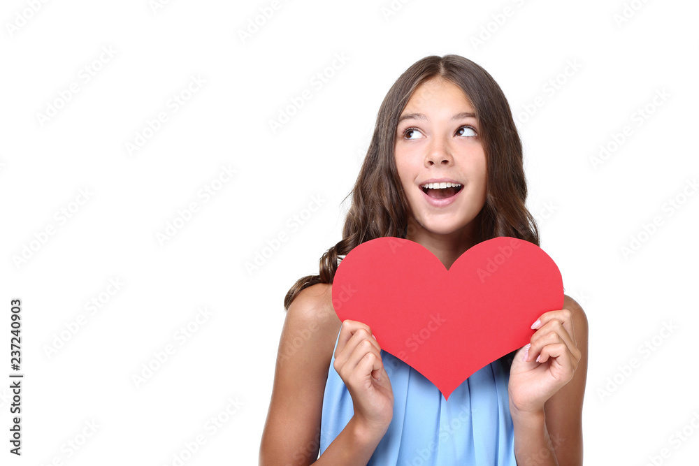 Young girl holding red paper heart on white background Young girl holding red paper heart on white background