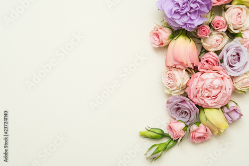 colorful flower composition on white background. roses and eustoma layout