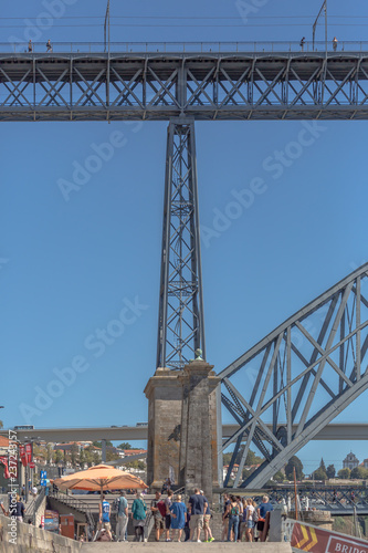 View of bridge pillar of D. Luis, with tourists enjoying © Miguel Almeida