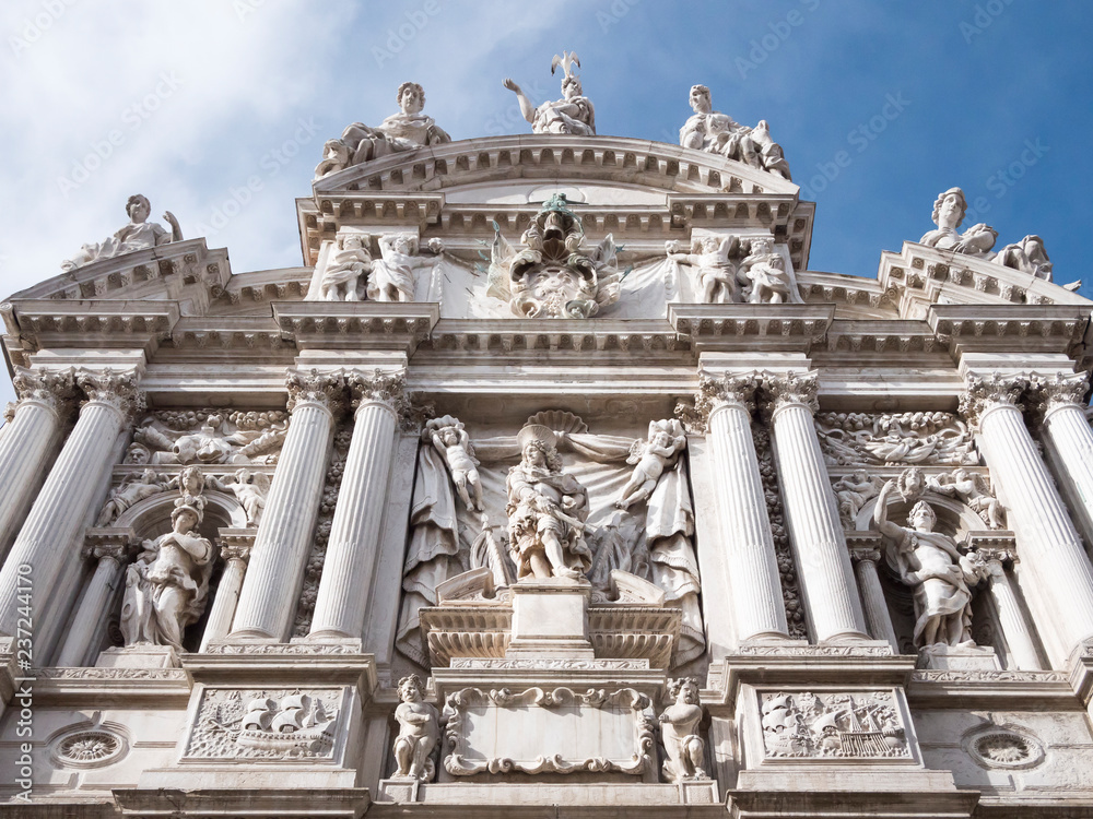 VENICE, ITALY, NOV 1st 2018: Santa Maria Zobenigo or Chiesa di Santa Maria del Giglio Church facade or exterior view. Venezia cityscape. Perspective ground view.